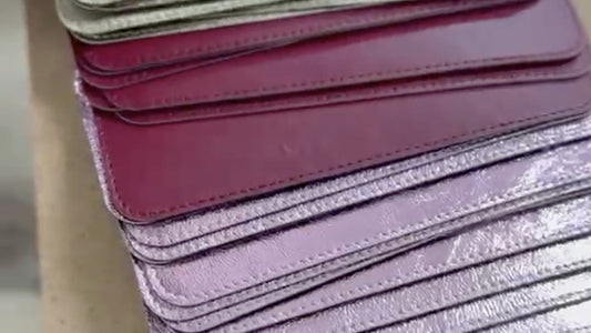 Stitched leather pieces stacked by color in the VIYAN workshop