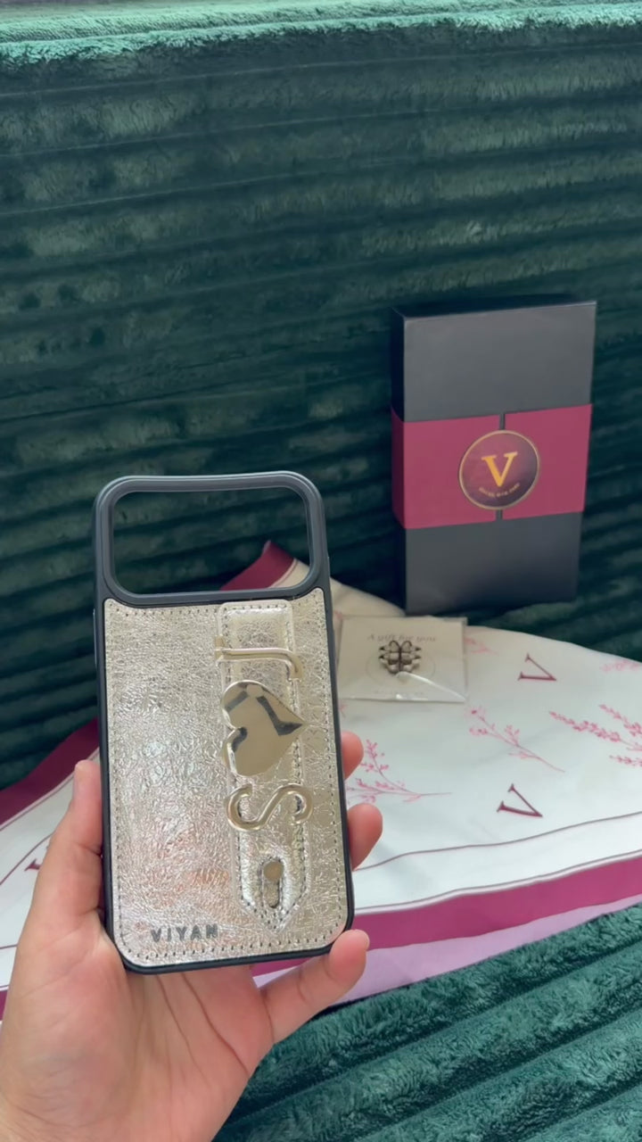 Personalized leather iPhone 17 Pro Max case — choose letter and symbol charms, two free. Genuine leather, soft-touch lining. Free US shipping over $70.