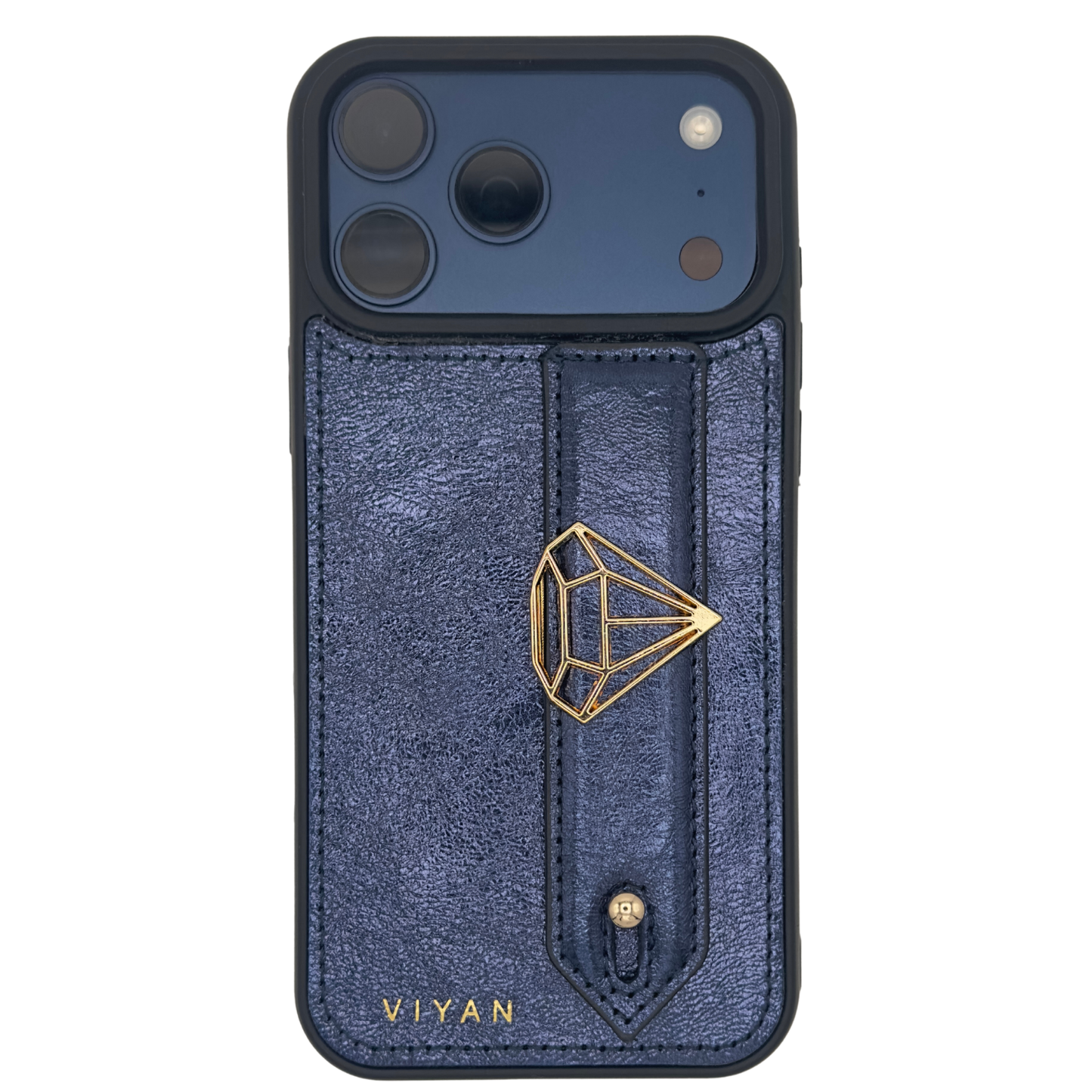 Gold-tone diamond charm on a Navy VIYAN leather iPhone case, shown at an angle #gold
